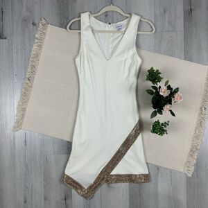 Bebe Asymmetrical Mini Dress Hem Off White Gold Trim Rhinestone Embellishment XS